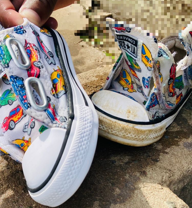 Cleaning white sneakers with brush